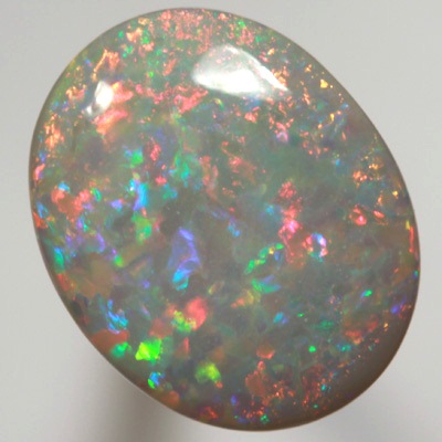 SOLID SEMI BLACK OPAL Top quality. Floral Harlequin pattern, Bright reds contrasted with turquoise greens SEE VIDEO  